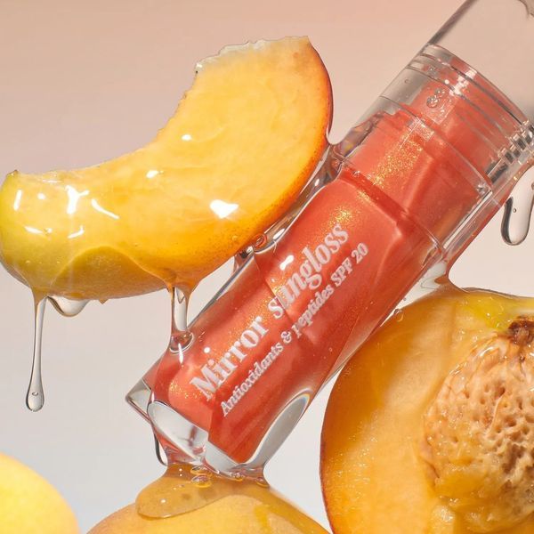 Hugs Mirror Sungloss Sparkling Bellini SPF 20+ PA++ Сонцезахисний блиск для губ, 5.5мл 2850 фото